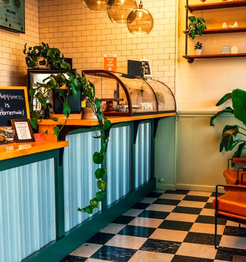 Inside Hinzi's Kitchen in Frederick — checkerboard floor and velvet chairs
